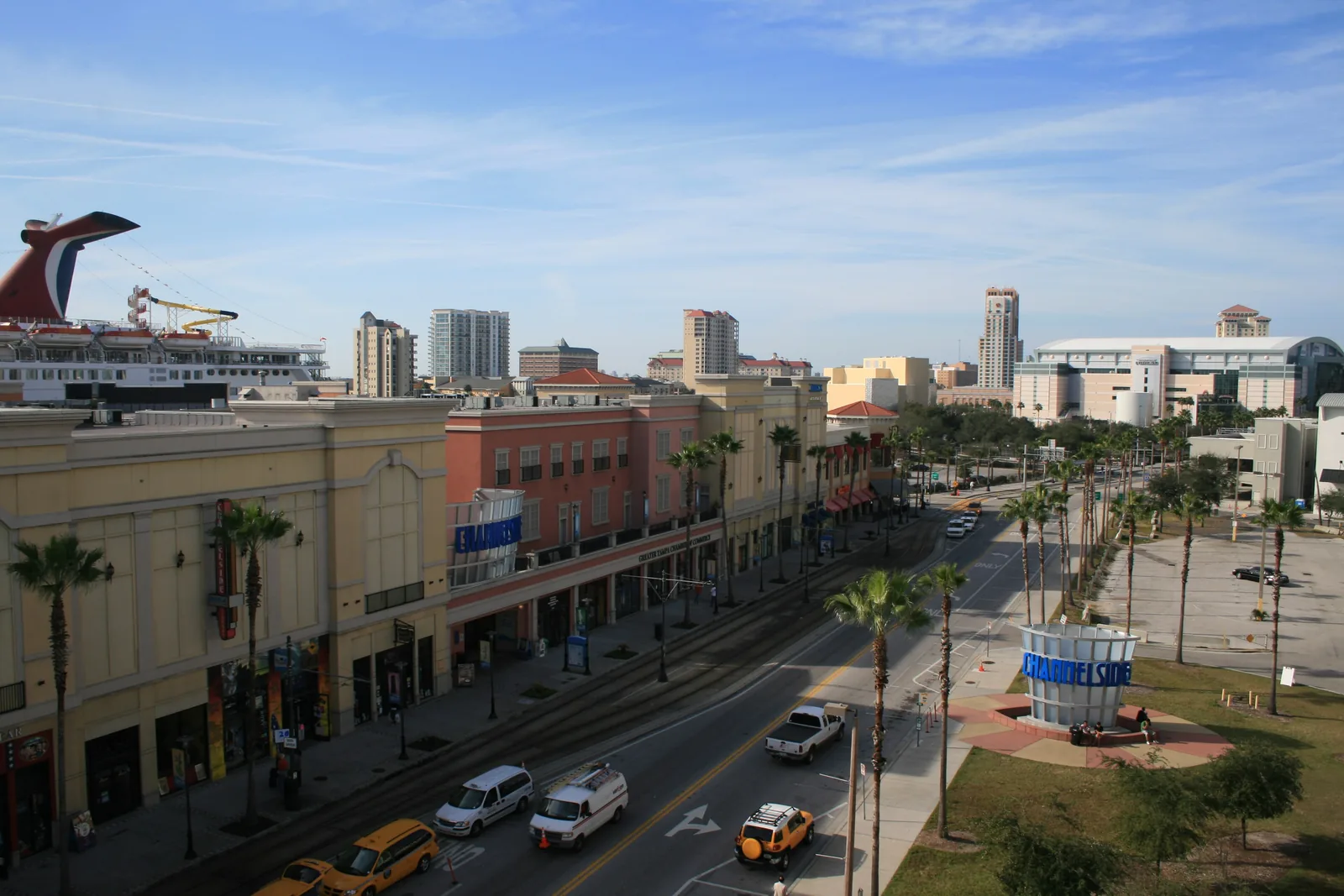 Channelside Drive in Tampa's Channel District, with the streetcar line, shops and apartment towers along it.