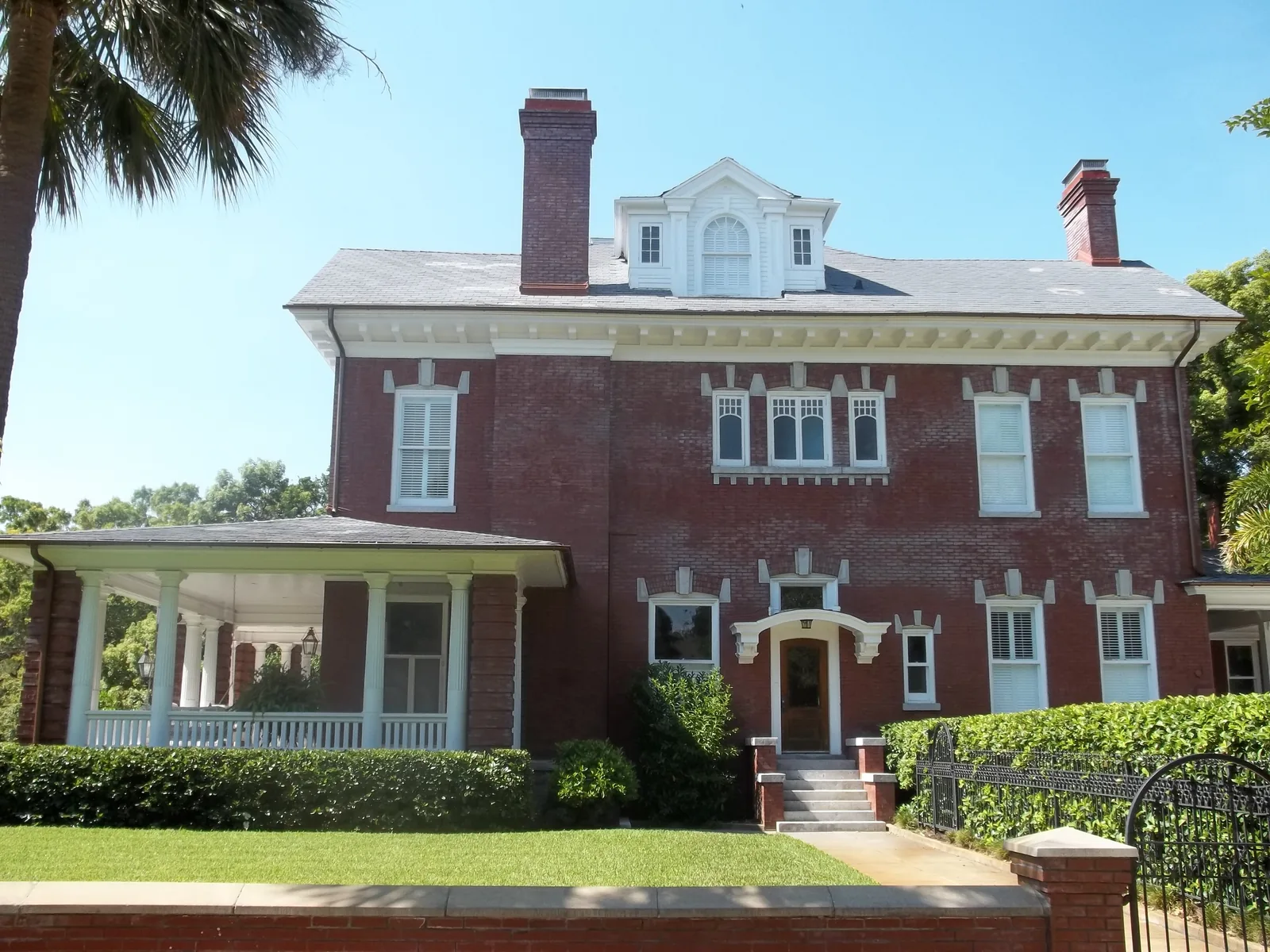 A brick house with a columned porch in the Hyde Park Historic District in Tampa.