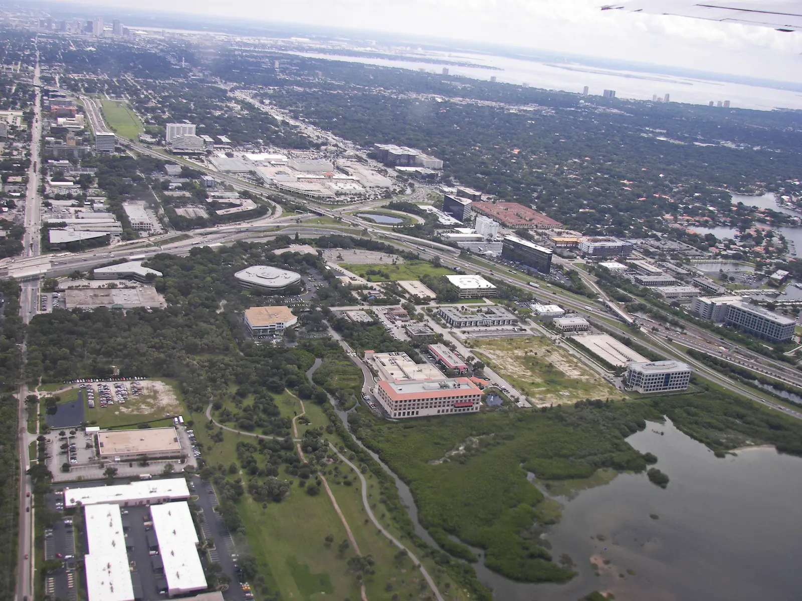 An aerial view over the Westshore district of Tampa, with offices, highways and Old Tampa Bay.