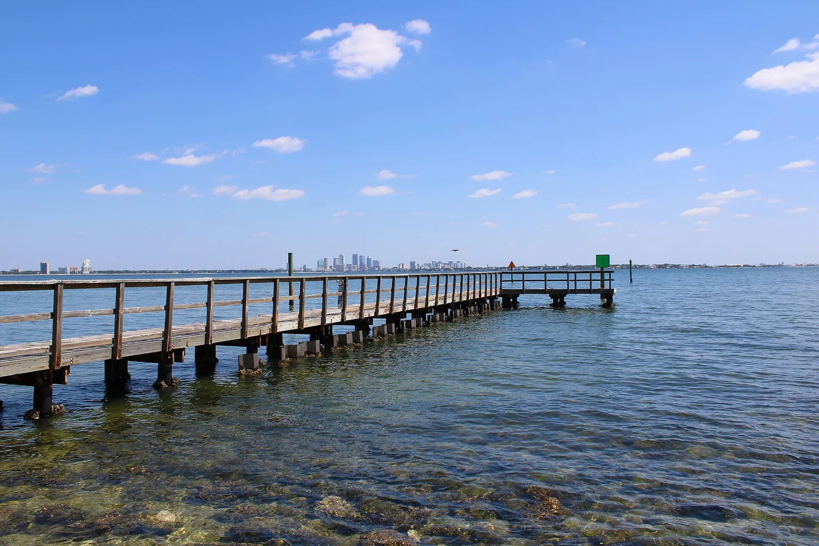 The pier at Ballast Point Park on Hillsborough Bay, with downtown Tampa in the distance.