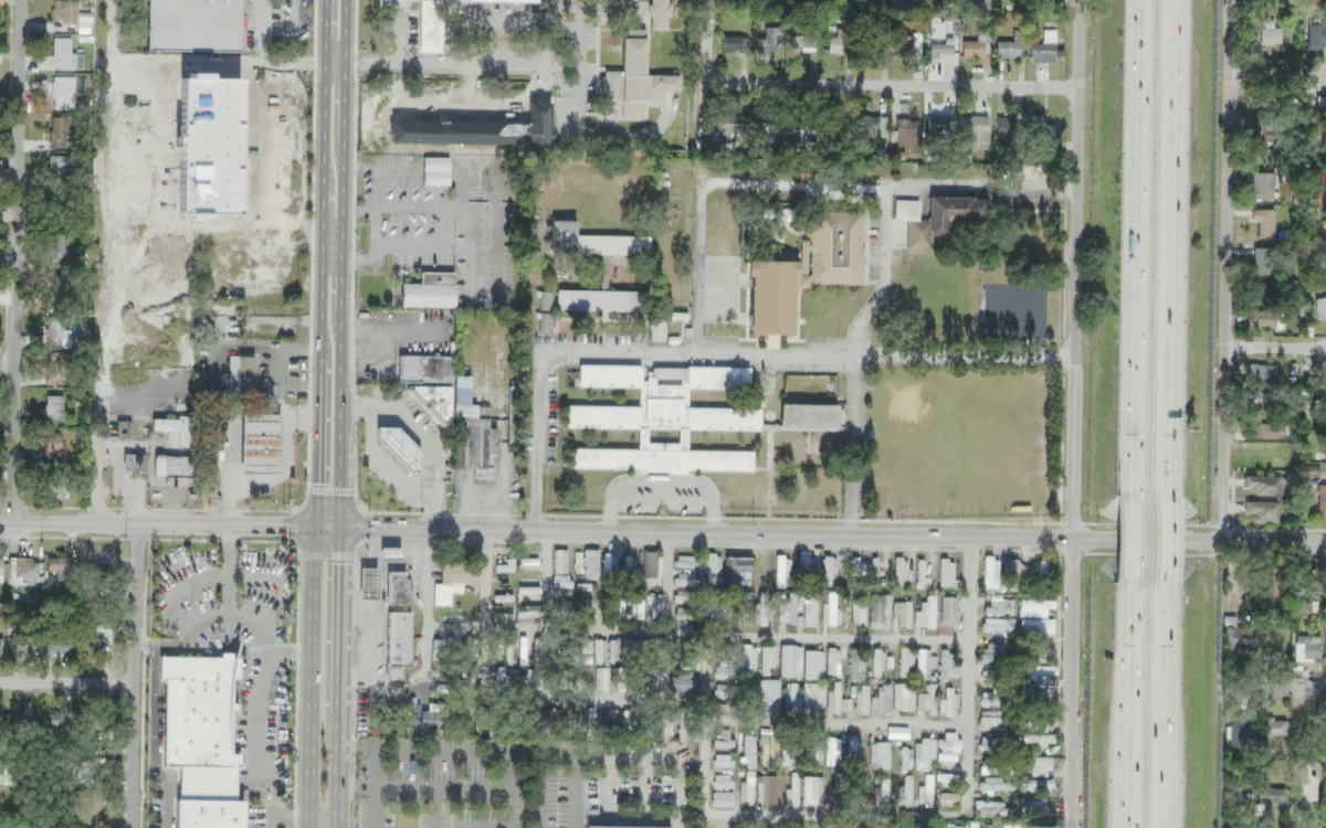 Legacy Preparatory Academy and the blocks around it on East Linebaugh Avenue in Sulphur Springs, Tampa, seen from the air, with Interstate 275 to the east