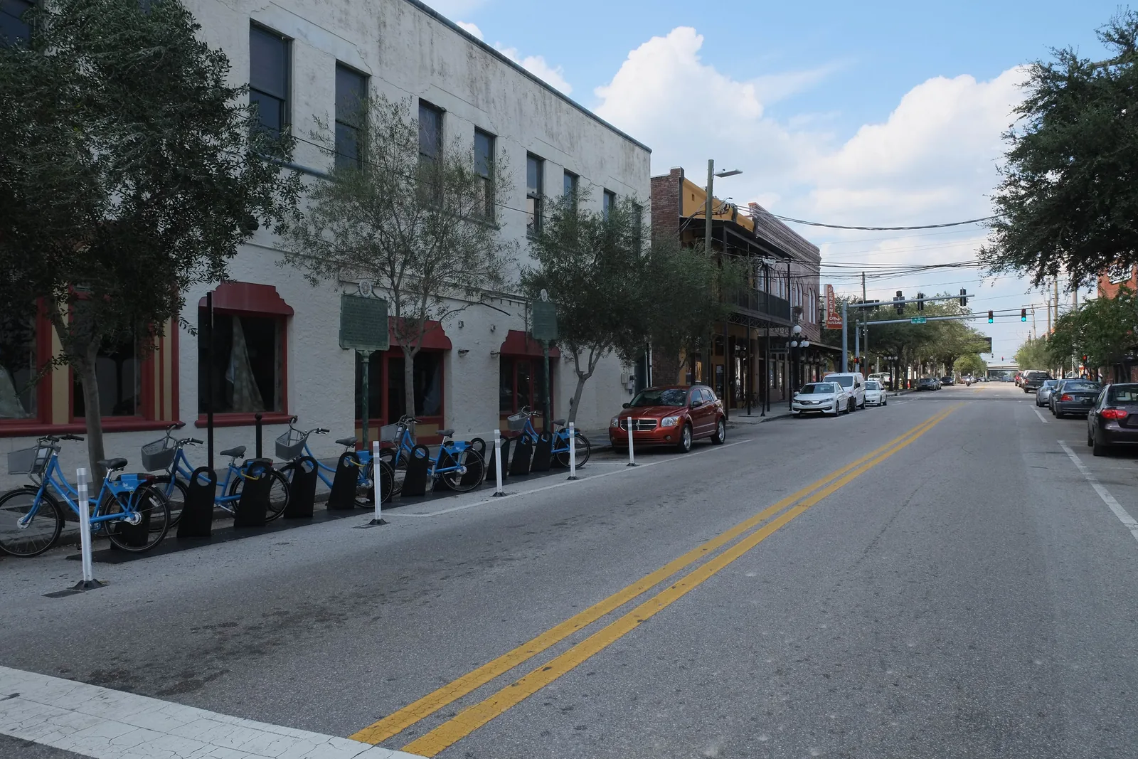 A bike share station beside a street in Tampa. The picture does not show the Green Spine.