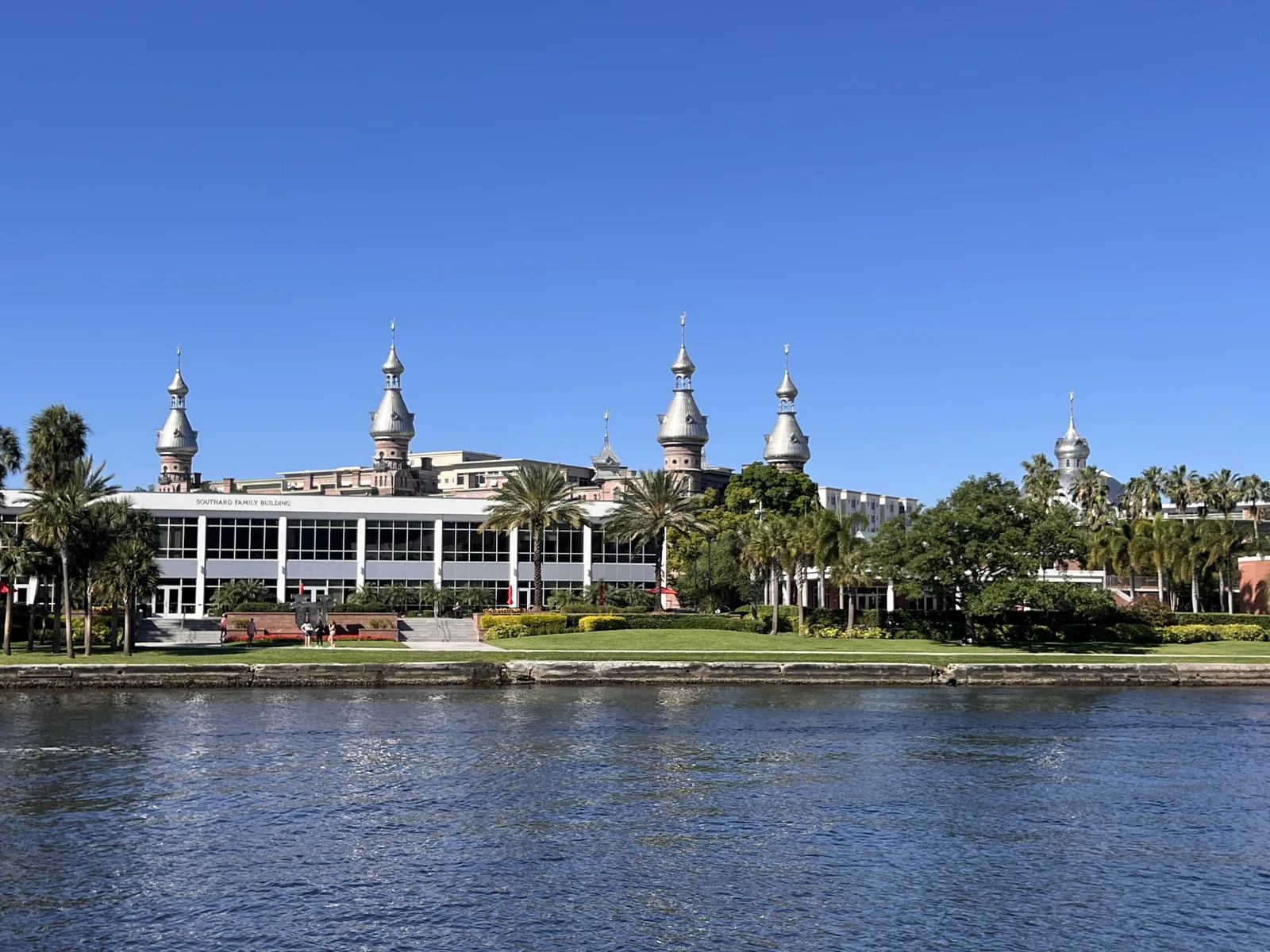 The silver minarets of the Henry B. Plant Museum and the University of Tampa seen across the Hillsborough River from the Tampa Riverwalk.