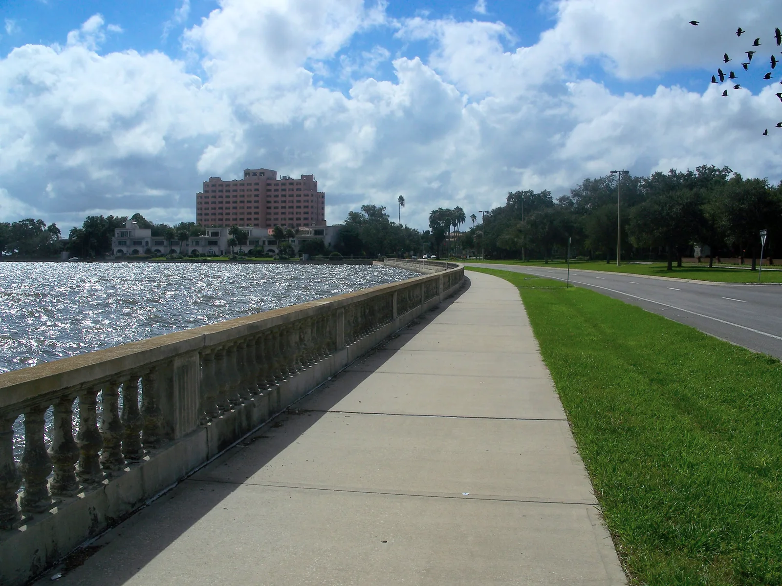 The balustrade and waterfront sidewalk of the Bayshore Greenway along Hillsborough Bay in South Tampa.